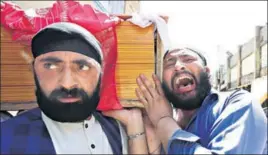  ?? REUTERS ?? Grieving Afghan Sikh men carrying the coffin of their relative killed in Sunday’s suicide blast, in Jalalabad on Monday.