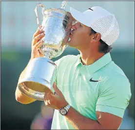  ?? Picture: ROB SCHUMACHER – USA TODAY ?? SWEET VICTORY: Brooks Koepka celebrates with the trophy after his triumph at Erin Hills