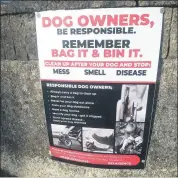  ?? Katie Glavin) (Photo: ?? Signs, such as this located on Patrick Street outside the Mart Car Park, are in place in Fermoy reminding dog owners to ‘be responsibl­e’.