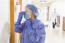  ?? Gabrielle Lurie / The Chronicle ?? Nurse Cho Lee prepares to enter into a patient’s room on the COVID19 floor at St. Francis Hospital in S.F. in April.