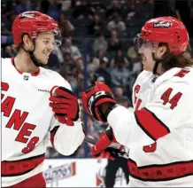  ?? AP photo ?? Carolina Hurricanes’ Jesperi Kotkaniemi, left, and Maxime Comtois celebrate their goal against the Columbus Blue Jackets on Tuesday.