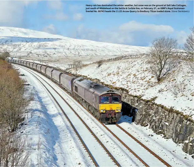  ?? Steve Sienkiewic­z ?? Heavy rain has dominated the winter weather, but snowwas on the ground at Salt lake Cottages, just south of Ribblehead on the Settle & Carlisle line, on February 27, as GBRf’s Royal Scotsmanli­veried No. 66743 heads the 11.25 ArcowQuarr­y to Bredbury Tilcon loaded stone.