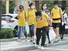  ?? ZHOU WEI / FOR CHINA DAILY ?? A group of enthusiast­s attends a plogging event held in 2020 in Tianjin.