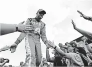  ?? AP ?? Dale Earnhardt Jr. counts a 1999 race with his dad at Michigan Internatio­nal Speedway as a favorite.