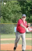  ?? Graham Thomas/Siloam Sunday ?? American Legion Siloam Post 29 commander Jim Wilbanks throws out the ceremonial first pitch prior to Wednesday’s doublehead­er at James Butts Baseball Park.