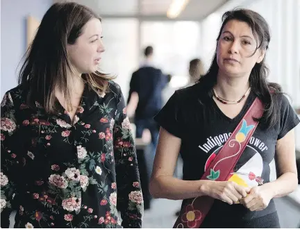  ?? ALLEN McINNIS ?? Allison Reid, left, and Nakuset take a break at a public inquiry into the mistreatme­nt of Quebec’s Indigenous Peoples on Wednesday.