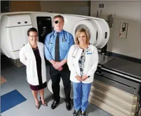  ?? PHOTO COURTESY ROME MEMORIAL HOSPITAL ?? Rome Memorial Hospital Radiation Medicine welcomes Board Certified Radiation Oncologist Michael Fallon, MD, MBA, center, to the practice at Chestnut Commons, 107E. Chestnut Street. Fallon; Director Amy Weakley, RT(T), CMD, BS, left; and Kelly Pietryka,...