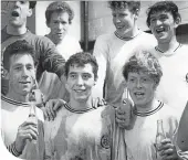  ??  ?? Johnny Watt (back right) celebrates in the Anfield dressing room after Stockport County had earned a replay