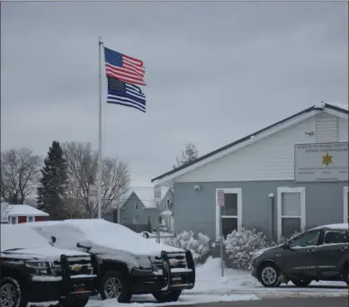  ?? JOSHUA WAGNER - MEDIANEWS GROUP ?? A look at the flags outside of the Madison County Sheriff Criminal Division Building.