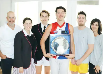  ??  ?? At home in Drouin after the national draft is the Gown family Anthony, Ella, Will, Noah (with his Gippsland Power best and fairest award), Jacob and Lisa.