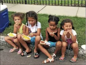  ?? MONICA SAGER — DIGITAL FIRST MEDIA ?? Nachos, burgers, hot dogs and watermelon were served at Pottstown’s celebratio­n of National Night Out.