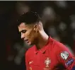  ?? Armando Franca / Associated Press ?? Portugal’s Cristiano Ronaldo reacts after Serbia scored in the 90th minute for a 2-1 win.