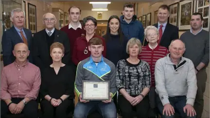  ??  ?? DCU student Ben Maddock is presented with the first Jack Pettit Memorial Sports Scholarshi­p at St. Peter’s College. Pictured, from left, back, Robert O’Callaghan (principal, St. Peter’s College), Sean Pettit, David Pettit, Mary Moloney, Fiona Moloney, Sean Phelan, Hannie Pettit, John Banville (vice principal, St. Peter’s College) and Paul O’Brien (DCU); and front, Liam and Julie Pettit (parents of the late Jack), Ben Maddock, and Suzie and Chris Maddock (Ben’s parents).