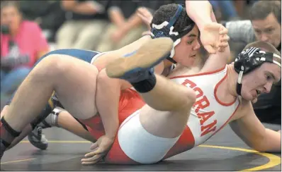  ?? TIM COOK/THE DAY ?? Ledyard’s Daric Johnson, left, controls Foran’s Ben Crull en route to winning the 220-pound title, 4-3, at the Class M wrestling tournament on Saturday at Law High School in Milford. Johnson, a sophomore, helped the Colonels rally past ECC rival...