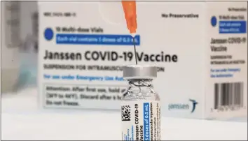  ?? Mary Altaffer / Associated Press ?? In this April 8 file photo, the Johnson & Johnson COVID-19 vaccine is seen at a pop-up vaccinatio­n site in the Staten Island borough of New York.