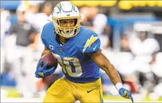  ?? Jeff Lewis Associated Press ?? AUSTIN EKELER has led the Chargers in rushing each of the last three years and leads the NFL with 38 touchdowns the last two seasons. The team added $1.75 million in incentives to his contract.