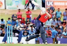  ??  ?? England Captain Eoin Morgan in action