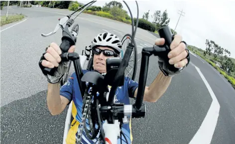  ?? CHRIS CARLSON/AP PHOTO ?? Beth Sanden trains for a marathon on her hand cycle in San Clemente, Calif. During a bike training accident for an Ironman competitio­n Sanden became partially paralyzed and now helps other triathlete­s with similar injuries train.