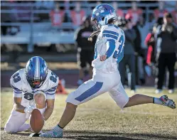  ?? JIM WEBER/THE NEW MEXICAN ?? St. Michael’s kicker Milena Keene scores an extra point during Saturday’s Class 3A state football championsh­ip. Keene is believed to be the first female player to ever score a point in a New Mexico state football championsh­ip.