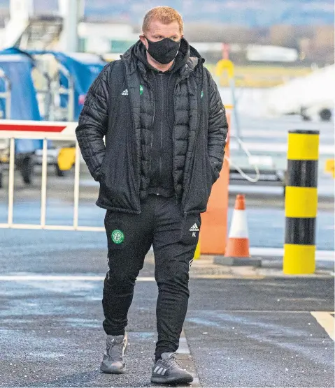  ??  ?? Neil Lennon at Glasgow Airport, about to head off to Dubai for the much-criticised winter training camp