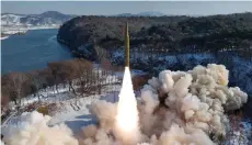 ?? Photo — AFP file ?? This picture shows the test-firing of an intermedia­te-range solid-fuel ballistic missile at an unconfirme­d location in North Korea. North Korea conducted a record number of missile tests last year – in defiance of UN sanctions in place since 2006 and despite warnings from Washington and Seoul