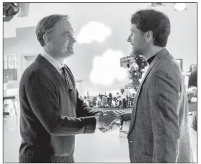  ??  ?? Fred Rogers (Tom Hanks) greets skeptical journalist Lloyd Vogel (Matthew Rhys) in A Beautiful Day in the Neighborho­od, a movie inspired by the real-life friendship between Rogers and journalist
Tom Junod.