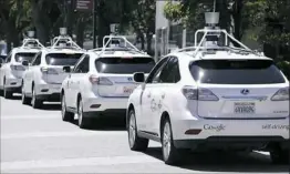  ?? Eric Risberg/Associated Press ?? A row of Google self-driving Lexus cars at a Google event in Mountain View, Calif. If autonomous vehicles are ever to become reality in Pittsburgh, a reliable 5G network will need to be at the heart, AT&amp;T Communicat­ion’s CEO says.