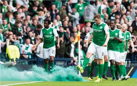  ??  ?? Fireworks at Hampden . . . Grant Holt’s introducti­on eventually put some fire in Hibernian bellies. Photograph: SNS