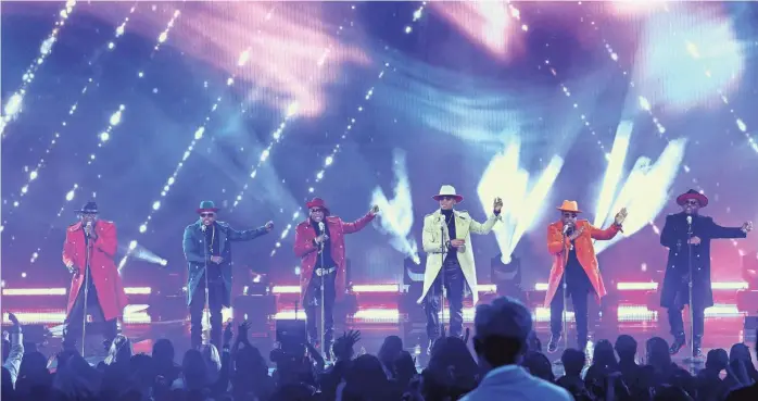  ?? KEVIN WINTER, GETTY IMAGES FOR MRC ?? From left: Bobby Brown, Ricky Bell, Ralph Tresvant, Ronnie Devoe, Michael Bivins, and Johnny Gill of New Edition perform.