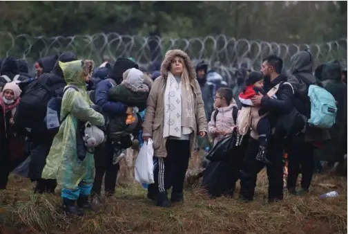  ?? File/associated Press ?? Migrants from the Middle East, Afghanista­n and elsewhere gather at the Belarus-poland border.