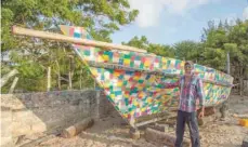  ??  ?? The constructi­on of the boat has been dubbed the Flipflopi project because of the hundreds of recycled plastic sandals that cover the vessel.