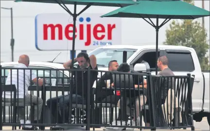  ?? PHOTOS BY DAVID ANGELL — FOR THE MACOMB DAILY ?? Patrons take their beverages on the patio at Starbucks on Hall Road on Sunday afternoon.