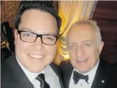  ??  ?? Able auctioneer Tyler Olson, left, helped raise $640,000 for maestro Bramwell Tovey’s VSO.