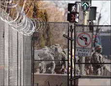  ?? Associated Press ?? National Guard troops continue to be deployed around the Capitol a day after the inaugurati­on of President Joe Biden.