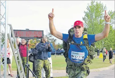  ?? SUBMITTED PHOTO/JAMES MACLELLAN ?? Cpl. James MacLellan, originally of Glace Bay, crosses the finish line to win the 2015 Army Iron Man event in Petawawa, Ont. MacLellan’s next challenge is the 2016 World Military Marathon Championsh­ip in Turin, Italy, on Sunday.