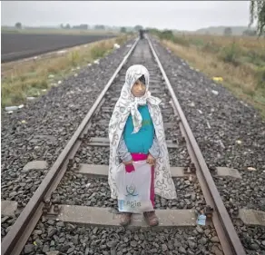  ?? MUHAMMED MUHEISEN/THE ASSOCIATED PRESS ?? The refugee crisis, with its images of human suffering — such as Syrian refugee Yasmeen Alhawal, 5 — can trigger stress among avid news watchers.