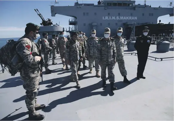  ?? EPA ?? Iranian military officials on board the ‘Makran’, the country’s largest military vessel, which can travel for about three years without docking