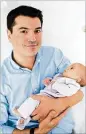  ?? CONTRIBUTE­D BY CLAIRE HARVEY PHOTOGRAPH­Y ?? Christian Broder holds his infant daughter. Broder, 34, was shot July 8 and died July 20.