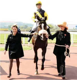  ?? Photo: JC Photograph­ics. ?? RESERVATIO­NS. Jockey Anthony Delpech believes Cascapedia, pictured with Jessica (left) and Mary Slack, has a few issues to overcome, but she has taken everything thrown at her in her stride so far and he will not rule her out in Saturday’s Sun Met.