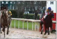  ?? (Arkansas Democrat-Gazette/Thomas Metthe) ?? Nadal (right), ridden by Joel Rosario, crosses the finish line to win the Rebel Stakes on Saturday at Oaklawn in Hot Springs. Nadal’s winning time was 1:44.97