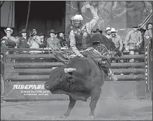  ?? AP/Profession­al Bull Riders/ANDRE SILVA ?? Bull rider Ezekiel Mitchell rides Last Chance during an event in Colorado Springs, Colo., in October. Mitchell played football and ran track because he didn’t have the background or financial means to learn how to ride a bull. So when it came to how to learn, he did what many teenagers do these days: He watched YouTube.