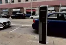  ?? STEPH MACHADO/GLOBE STAFF ?? A new multi-space parking meter, which accepts every form of payment, on Dorrance Street.