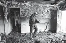  ?? Godofredo A. Vasquez / Staff photograph­er ?? Mason Wright Jr. cleaned his hands after looking through the debris for anything worth salvaging from his father’s home.