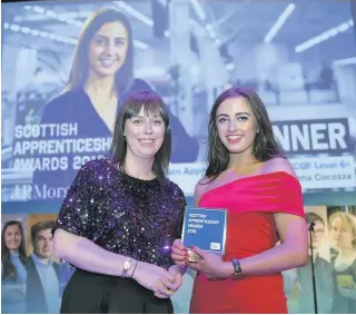  ??  ?? Worthy winner JP Morgan executive director Gillian Mclennan hands over to award to Lorena Cocozza