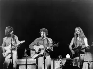  ??  ?? Dylan with Harrison and Russell, who performed a show-stopping medley of “Jumpin’ Jack Flash” and “Young Blood.”