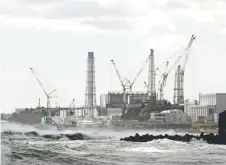  ?? Photo — AFP ?? The Fukushima Daiichi nuclear power plant is seen from Futaba Town, Fukushima prefecture. Tepco has temporaril­y suspended the release of wastewater from Fukushima nuclear plant following an earthquake.