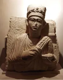  ??  ?? A restored statue for Yalhi Yalhabouda, a high priest in Palmyra, is displayed in an exhibition, at the Opera house.