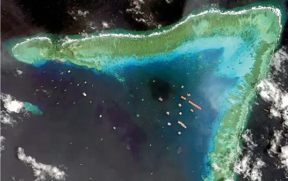  ?? MAXAR TECHNOLOGI­ES/ AP ?? A satellite image of Chinese vessels at the Whitsun Reef in March this year.