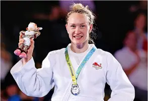  ?? Picture: Mark Kolbe/getty Images ?? Silver medallist Gemma Howell of Team England celebrates during the Women’s Judo -63kg medal ceremony