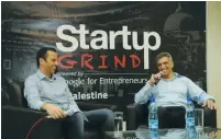  ?? (Courtesy) ?? VENTURE CAPITALIST Yadin Kaufmann (right) talks with Palestinia­n entreprene­ur Peter Abualzolof at a conference in Ramallah in 2014.